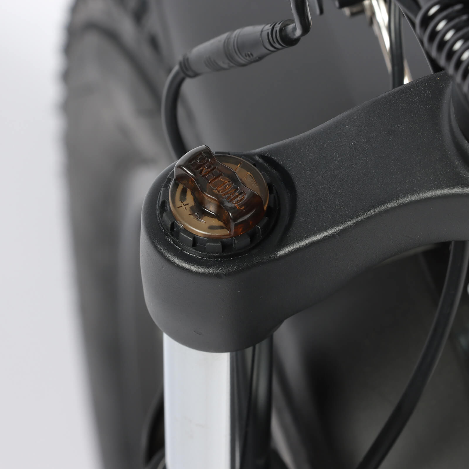 Close-up of suspension adjuster on Baolujie DP-2602 48V dual motor off-road electric bike.