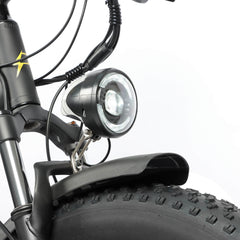 Front light of Baolujie DP-2602 48V dual motor electric bike for safe night riding.